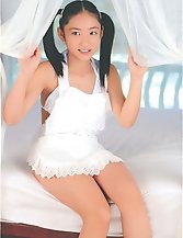 Cute in pigtails this Asian slut enjoys showing off her body